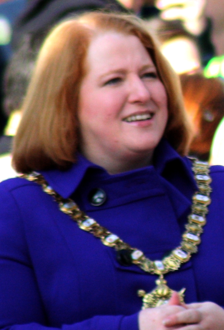 Cropped image of Naomi Long (from File:Belfast City Marathon, May 2010 (08).JPG ), before the start of the Belfast City Marathon 2010, Donegall Square North, Belfast, Northern Ireland, May 2010