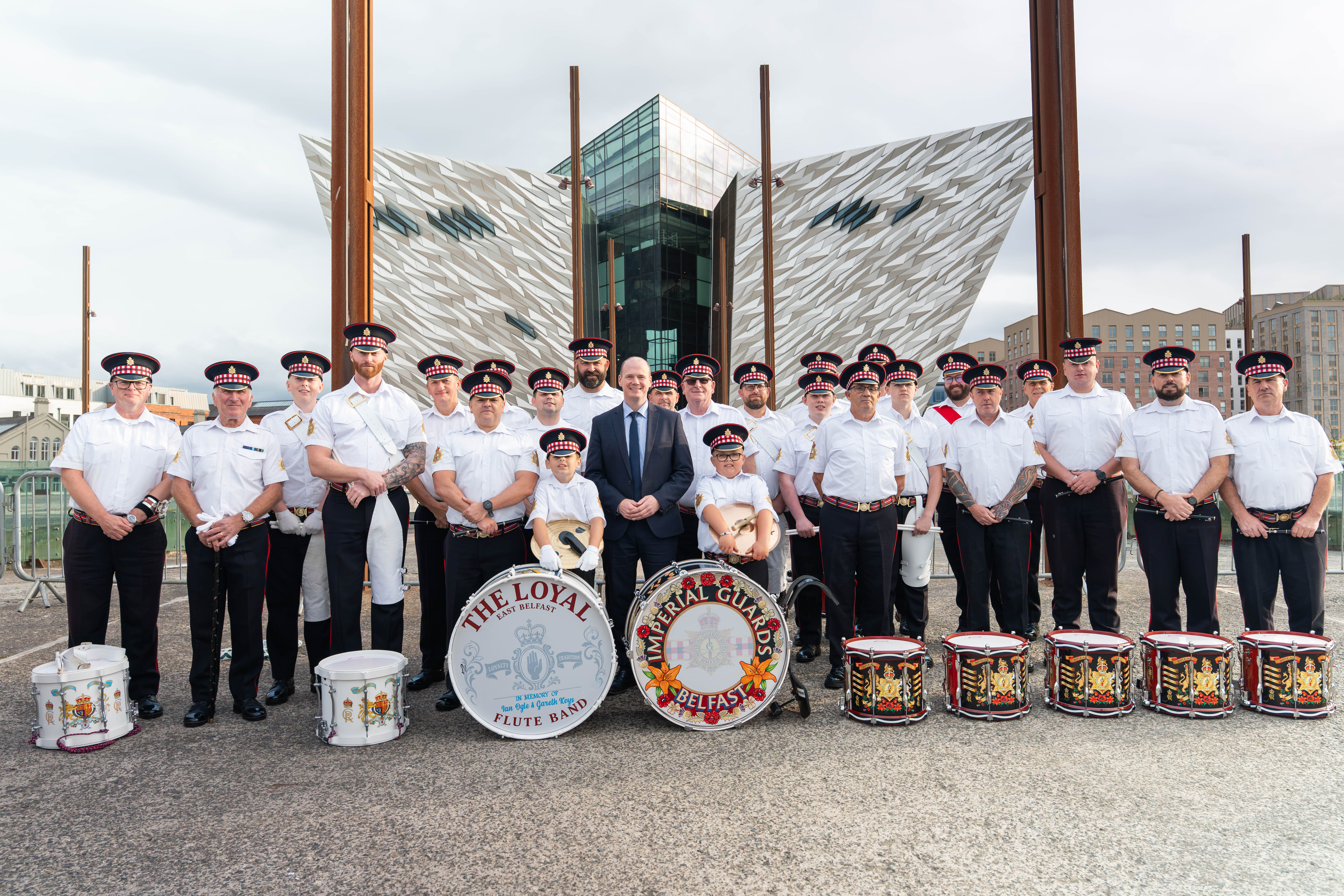 Communities Minister Gordon Lyons pictured with the Loyal Flute Band and the Imperial Guards Flute Band at the Fleadh who were awarded support from the Musical Instruments Programme