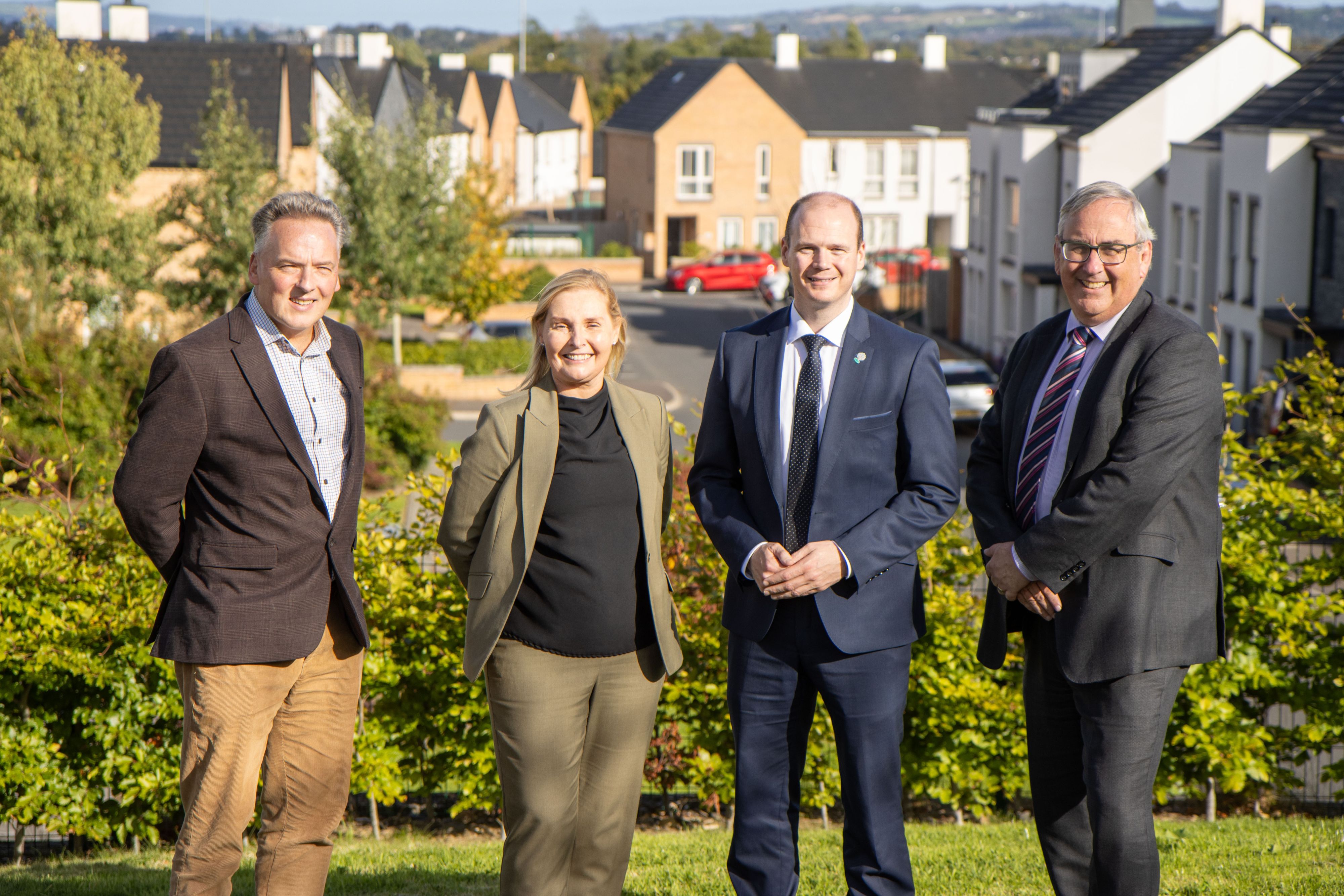 Communities Minister Gordon Lyons is pictured at Blacks Gate in Belfast with, from left, John McLean (Radius Housing CEO), Anita Conway (Director of Development, Radius Housing) and Martin Pitt (Chair of Radius Housing Association).