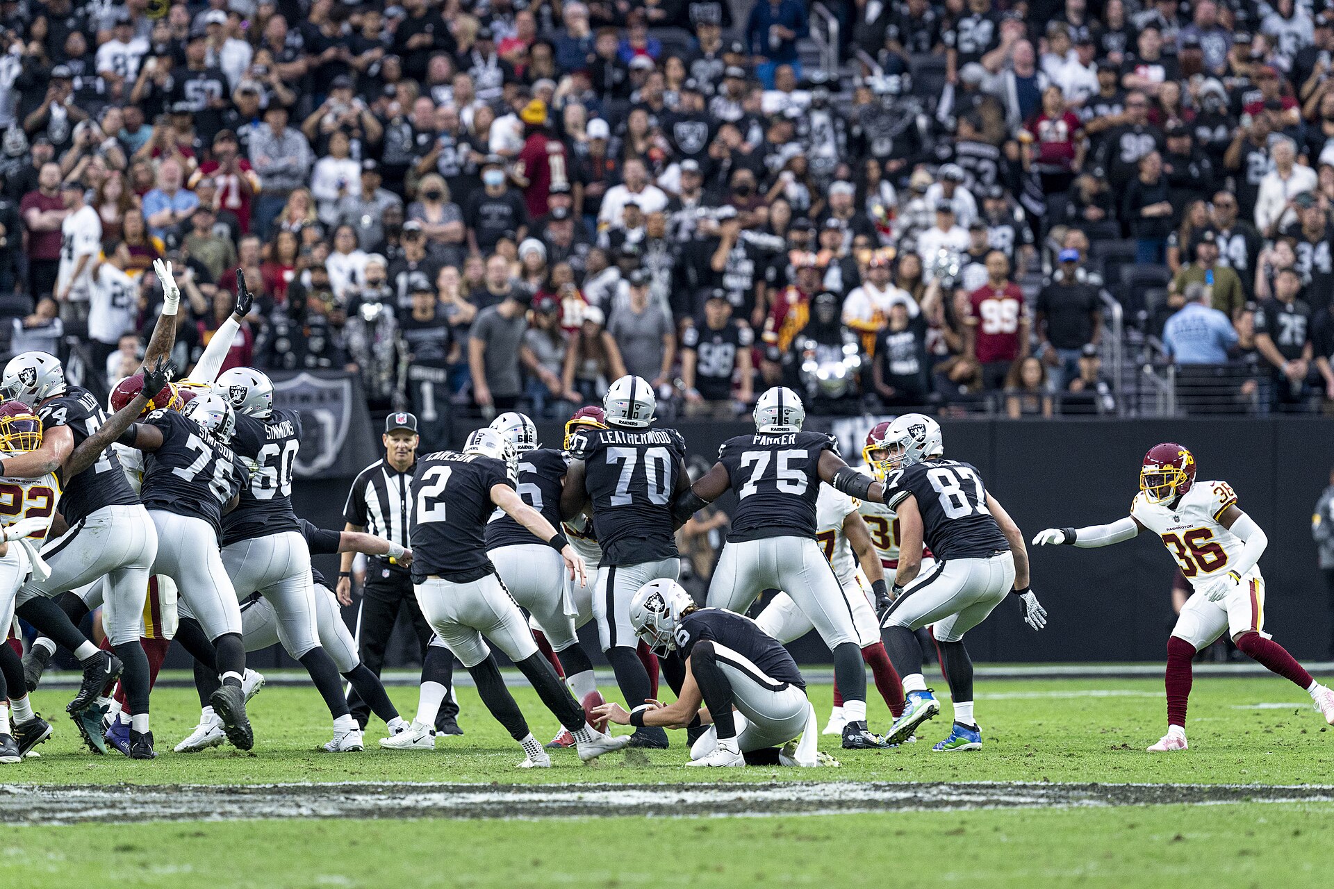 Las Vegas Raiders placekicker, Daniel Carlson, kicking a field goal in a game against the Washington Football Team at Allegiant Stadium on December 5, 2021.