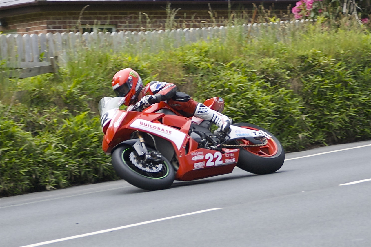 James Hillier entering the right side-junction to The Nook at Old Bemahague Road, Douglas, Isle of Man TT Senior race in 2009