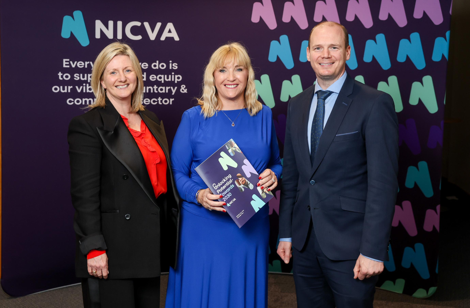 Communities Minister Gordon Lyons pictured with (left to right) Department for Communities Permanent Secretary Grainia Long and Chief Executive of NICVA Celine McStravick