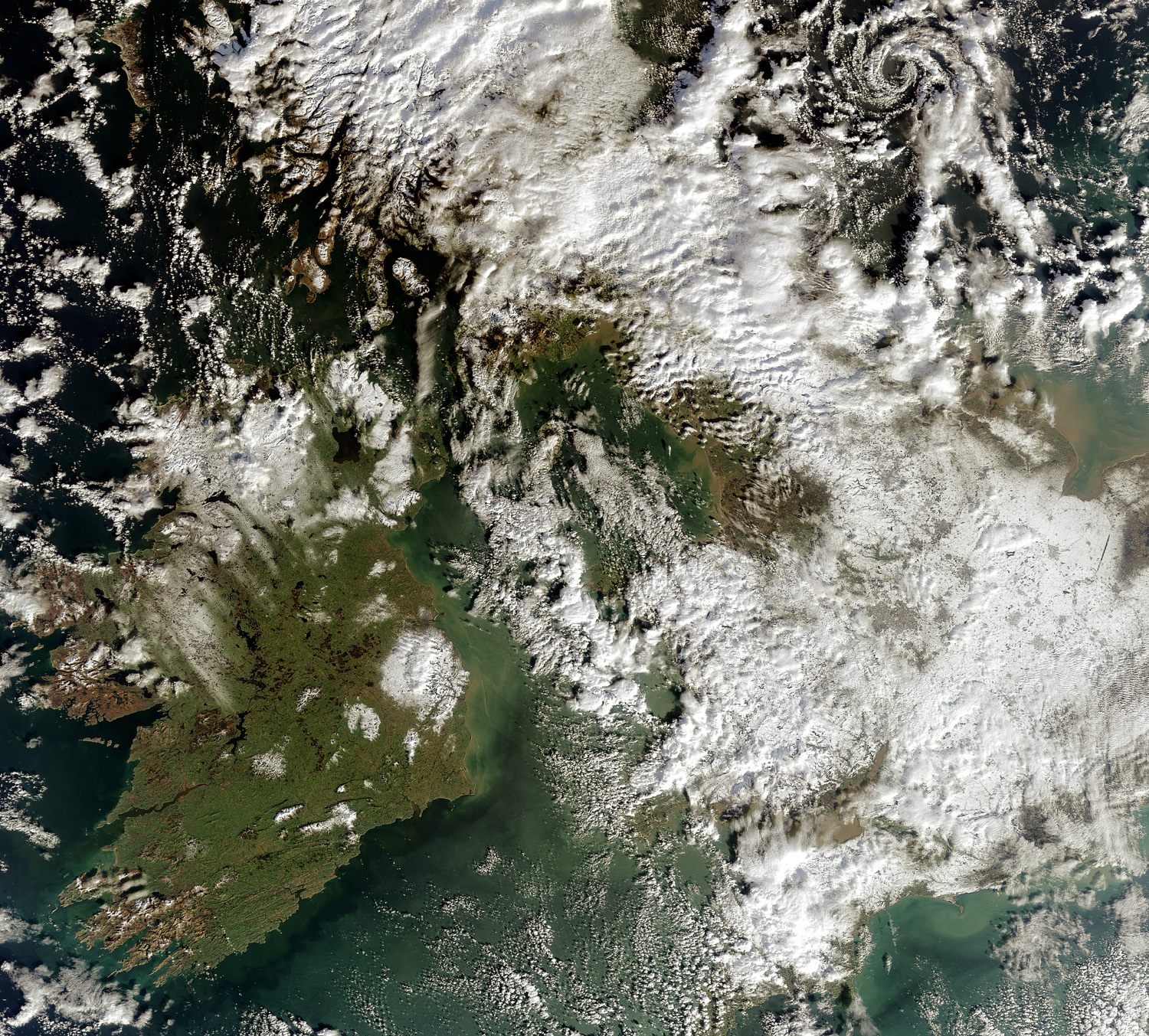 Envisat's Medium Resolution Imaging Spectrometer (MERIS) instrument acquired this image over Great Britain and Ireland on 7 February 2009. The island of Great Britain (on the east, or right), is largely covered by clouds but white patches of snow are also visible. Severe storms have been wreaking ha