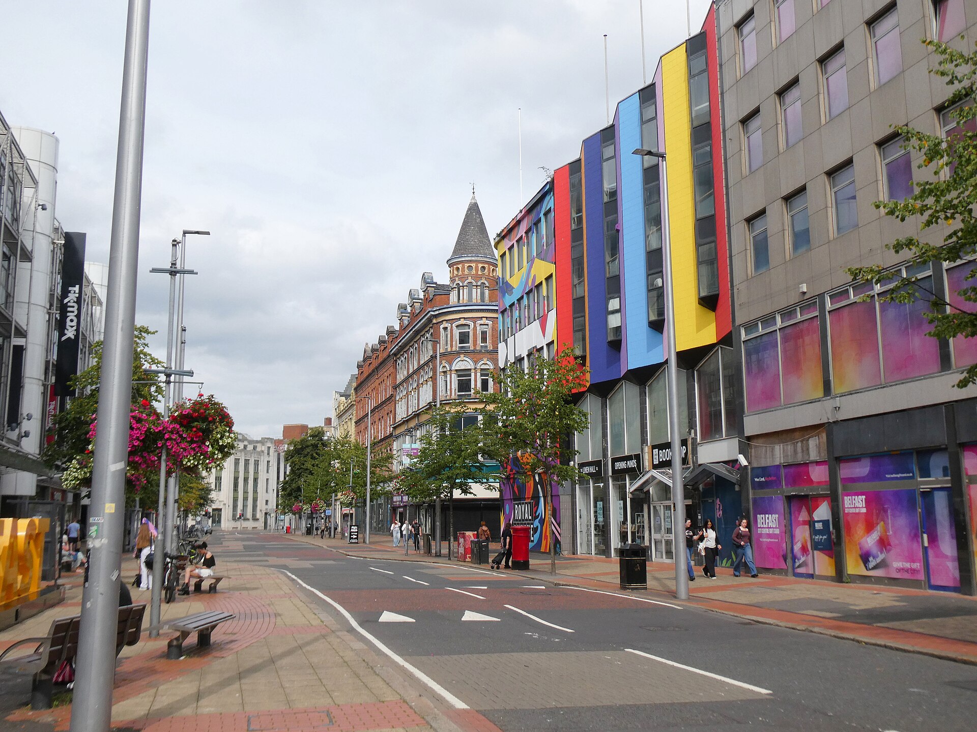Royal Avenue in Belfast city centre with pedestrians using the broad pavements